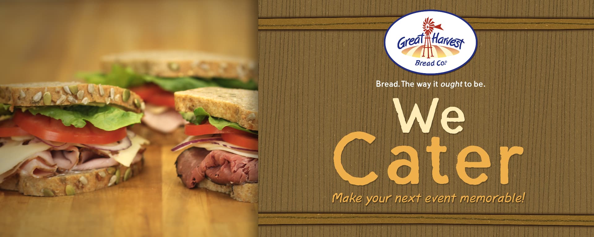 Catering spread of stacked sandwiches on seeded Great Harvest bread with the Great Harvest Bread Co. logo and We Cater message